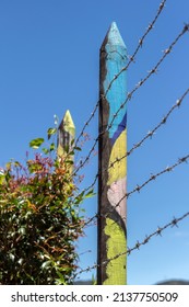 Multicolored Painted Wood Stake In The Country Around Guatape, Colombia.