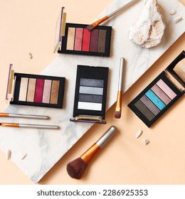 Multi-colored palettes for eye shadows, makeup and female beauty. Photo for advertising cosmetics and makeup