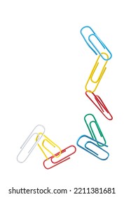 multi-colored paper clips fly on a white background, copy space