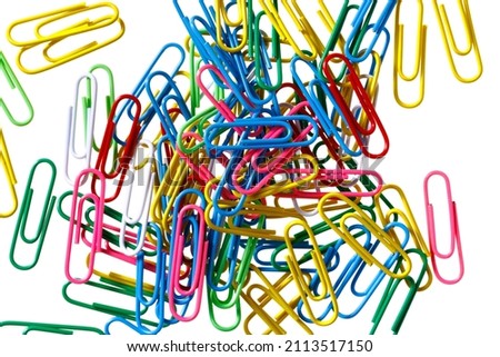 Similar – Colorful paper clips on a black board surface