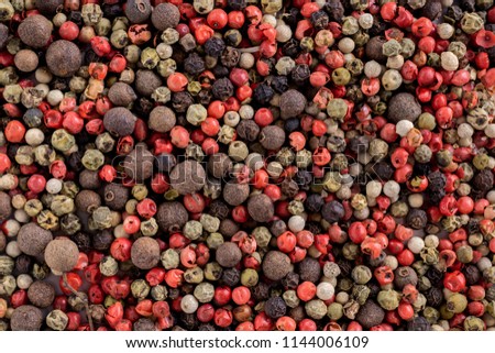 Multicolored pea of red, green, black and sweet pepper