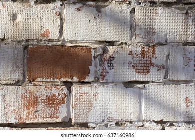Multicolored peeling wall texture and background. Painted brickwork.