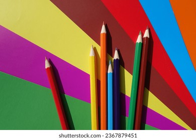 multicolored pencils on colored paper