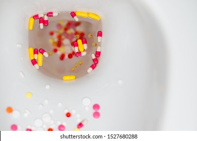 Multi-colored Pills Float In The Toilet, Flush Medicines Into The Toilet, Top View