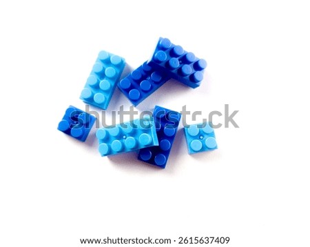 Multi-colored plastic blocks background closeup. Texture toy blocks in different colors making up a shape. Child games. Leisure and recreation. Childrens building blocks construction