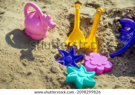 Multi-colored plastic toys for children to play in the sand on the beach and in the sandbox.