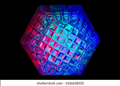 Multicolored rays of light shine through crystals with hexagonal faces - Powered by Shutterstock - Get 15% off with code: PIKWIZARD15