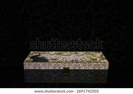 Multicolored rectangular artistic celebration box, black background. Conceptual Diwali theme photography. Local artwork piece. 