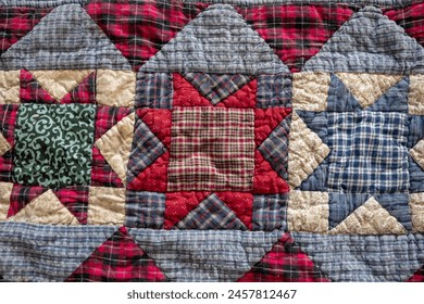 Multi-colored, red and blue patchwork quilted background.