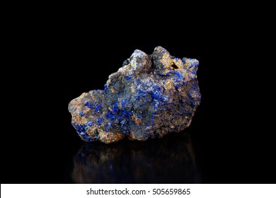 Multicolored rock with lazurite crystals on black background close view - Shutterstock ID 505659865