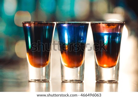 Multicolored shots on the bar