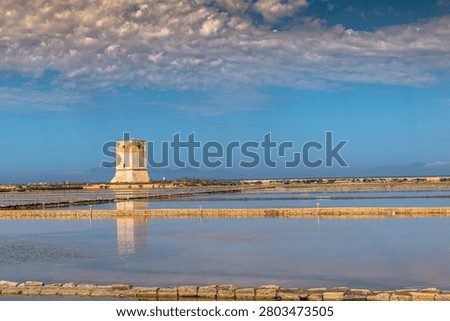 The multicolored spectacle of the Trapani salt pans—a blend of sky, earth, sun, and sea