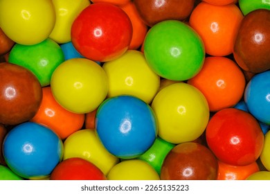 Multi-colored spherical balls candies in bulk close-up, full depth of field background wallpaper, uniform texture pattern - Powered by Shutterstock