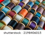 Multi-colored spools of thread close-up. Sewing threads multicolored background closeup	