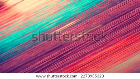 Multicolored straight strands texture background, sewing equipment, loom equipment at a garment factory