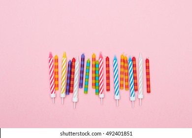 Multi-colored Striped Candles For Birthday In Line. Minimalism. Flat Lay.