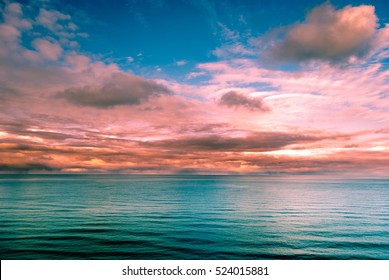 Multicolored surreal sunset view of a sea horizon. Beautiful landscape photography. Background tecture for travel and adventure. - Powered by Shutterstock