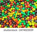 Multi-colored sweet candies (confectionery) of different colors. Colorful abstract background. Many Colorful Chocolate Candies for background. 