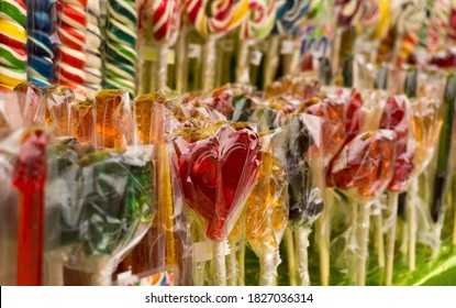 Multicolored sweet lollipops of different shapes of hearts and sticks - Shutterstock ID 1827036314