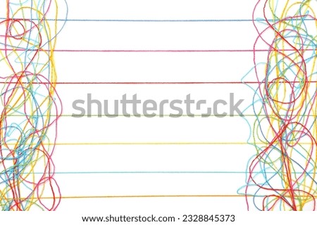 Multicolored tangled and lined knitting threads on both sides of a white background