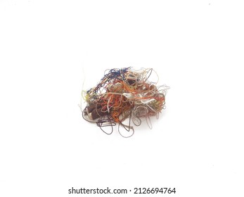 Multi-colored tangled threads abstract texture pattern background. Macro shot of colorful needlecraft silk thread ropes. Colored natural thread pile for sewing clothe scattered randomly like spaghetti