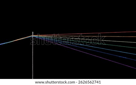 multi-colored threads for sewing in the form of a rainbow pass through an antique needle on a black background close-up