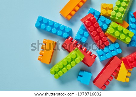 Multi-colored toy bricks from above
