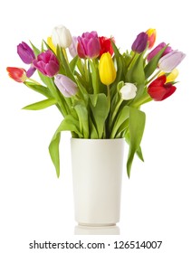 Multicolored tulips in a vase, isolated on white background