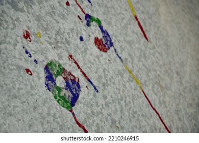 Multicolored Typos Of Palms On A Metal Sheet. Traces Of Different Light Palms On The Wall With Smudges.