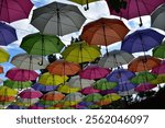 Multi-colored umbrellas against the sky at the lower station on the cable car in Pyatigorsk