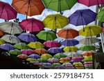 Multi-colored umbrellas against the sky at the lower station on the cable car in Pyatigorsk