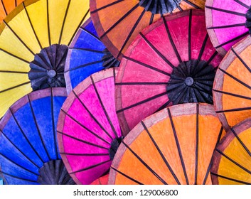 Multicolored Umbrellas At Night Market In Luang Prabang - Laos Pdr - Vintage Retro Background Representing South East Asia Cultures