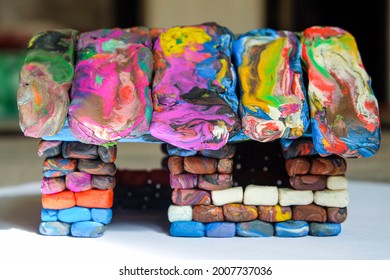 Multi-colored voluminous plasticine house from small piece block elements. Kid toy. Side view. - Shutterstock ID 2007737036
