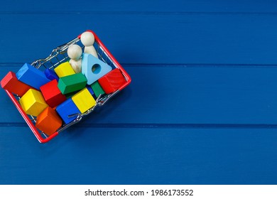 Multicolored Wooden Blocks, Cars, Train In Basket On Blue Background. Trendy Eco-friendly Puzzle Toys. Educational Toys For Kindergarten, Preschool. Back To School. Online Shopping For School.