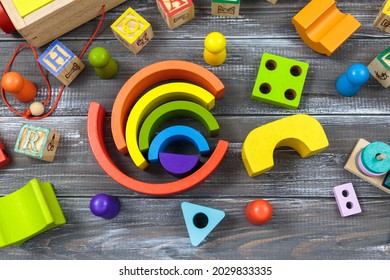 Multicolored Wooden rainbow toy,  blocks on wooden table. Back to school, games for kindergarten, preschool education. - Powered by Shutterstock