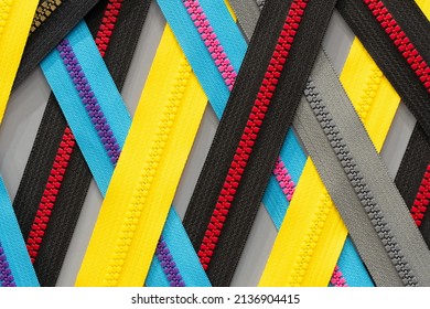 Multicolored Zippers or Zip Fasteners used for binding fabric or textile. Colorful Clasp Lockers Background or Pattern concept of Clothing Industry, Secret Keeper, Truth Revealing, Adhesion, Adherence