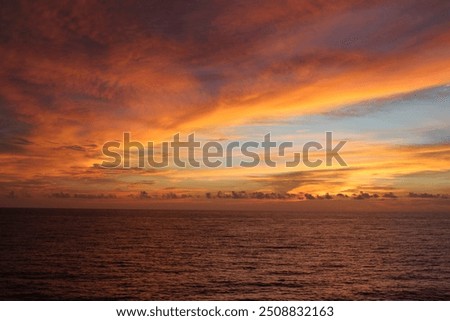 Multicoloured cloud ocean sunset view