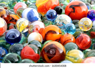 Multicoloured Toy Marbles Of All Colours And Designs. A Childhood, Collector, Or Diversity Concept. 