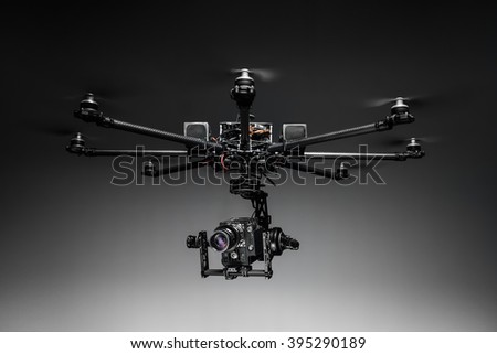 Multicopter closeup on studio background. Drone with professional camera. Octocopter for filming. 