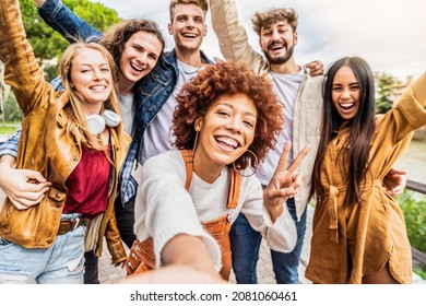 Multicultural Best Friends Having Fun Taking Group Selfie Portrait Outside - Smiling Guys And Girls Celebrating Party Day Hanging Out Together On City Street - Happy Lifestyle And Friendship Concept