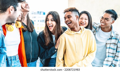 Multicultural best friends having fun hanging out together - Happy young people laughing walking on city street - International students talking outside school in college campus - Friendship concept - Shutterstock ID 2208721983