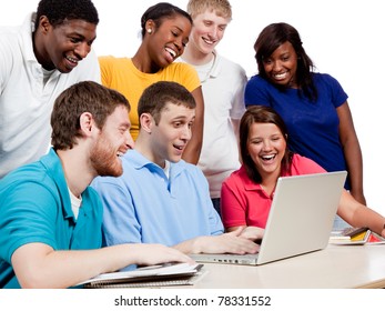 Multicultural College students/friends, male and female, gathered around a computer