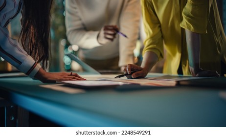 Multicultural Creative Colleagues Discussing a New Business Opportunity, Talking in an Office Meeting Room, Using Laptop Computer. Close Up on Hands of Team Members. - Shutterstock ID 2248549291