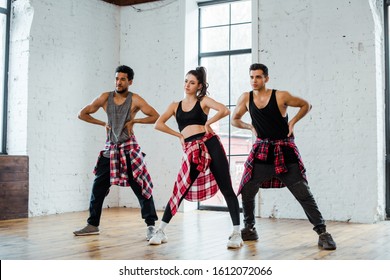 Multicultural Dancers With Hands On Hips Dancing Jazz Funk