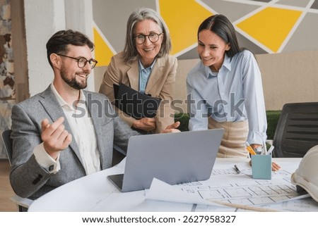 Multicultural designers sharing creative ideas during a meeting in a modern office. Group of innovative businesspeople having a discussion while working on a new project.
