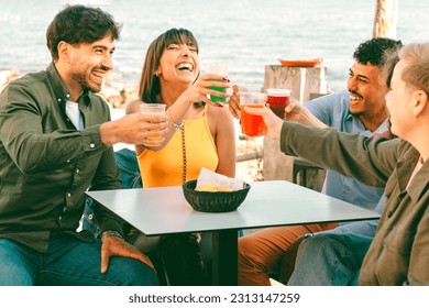 Multicultural Friends Brining with Colorful Cocktails by the Seaside - Powered by Shutterstock