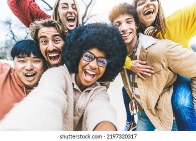 Multicultural friends taking selfie picture outside - Group of young people laughing at camera together - Happy diverse students having fun in college campus - Friendship concept