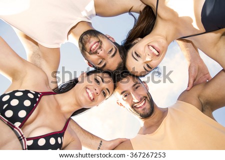 Similar – Young people with their heads together having fun