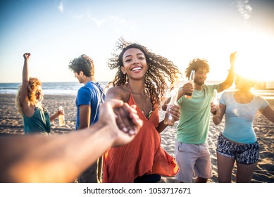 Multicultural Group Of Friends Partying On The Beach - Young People Celebrating During Summer Vacation, Summertime And Holidays Concepts