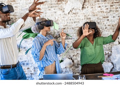 Multicultural group using VR headsets in a contemporary office. Diverse professionals experiencing immersive technology, showcasing innovation and teamwork. - Powered by Shutterstock